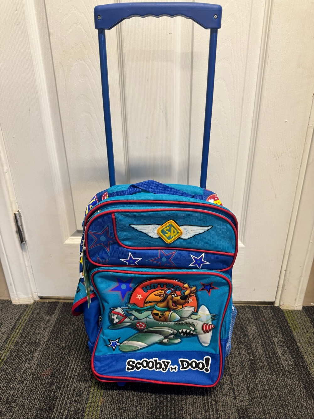 Vintage Scooby-Doo rolling backpack features a pilot graphic of Scooby-Doo